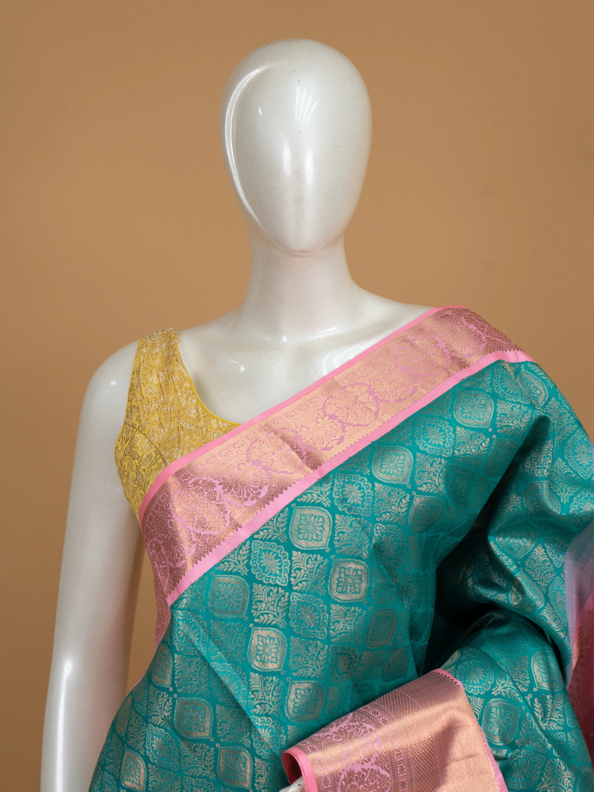 Teal green pure Kanchipuram silk saree with gold zari brocade body and contrast pink zari border