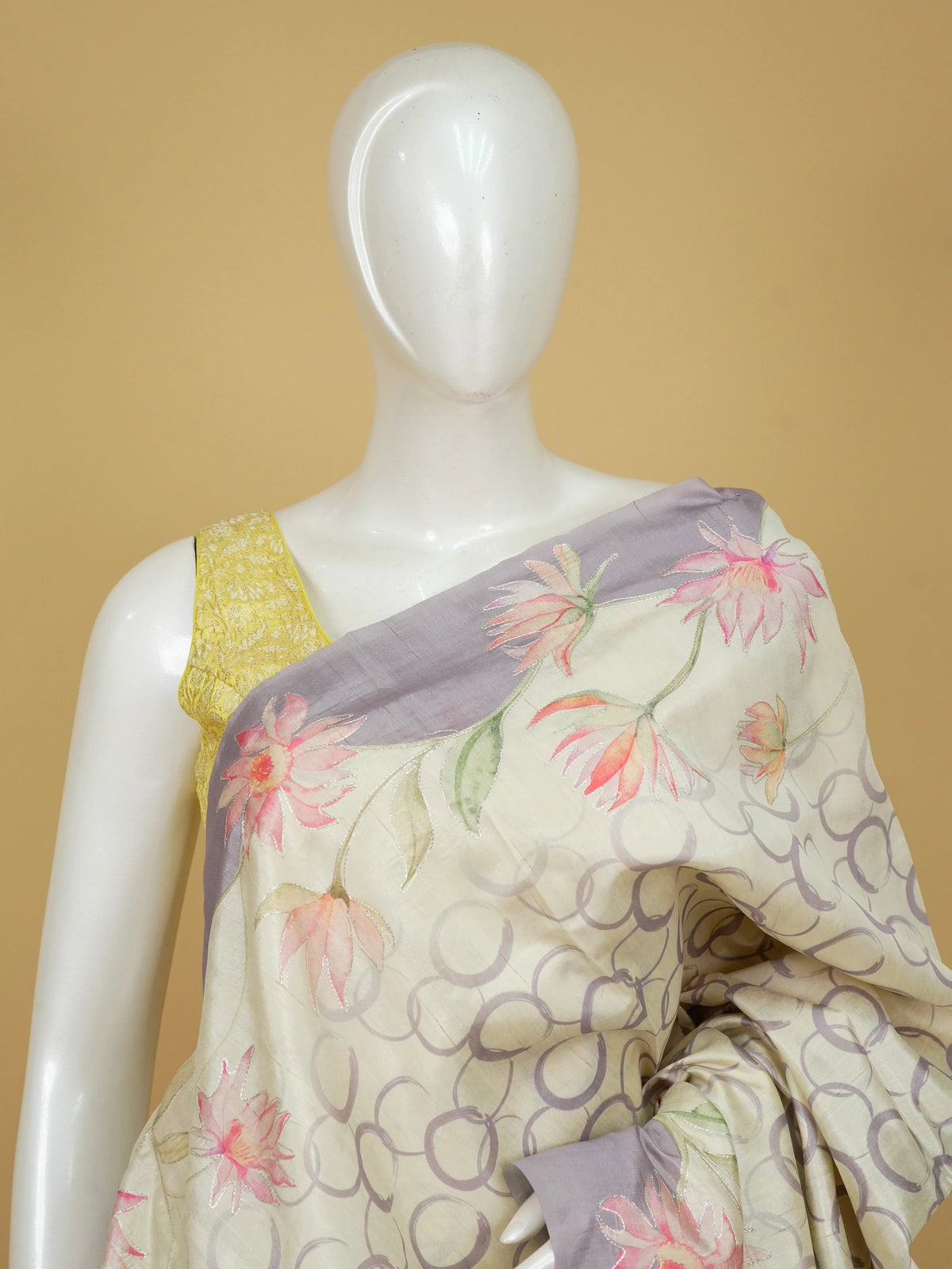 Cream and lavender designer silk saree with hand-painted lotus florals and silver thread work