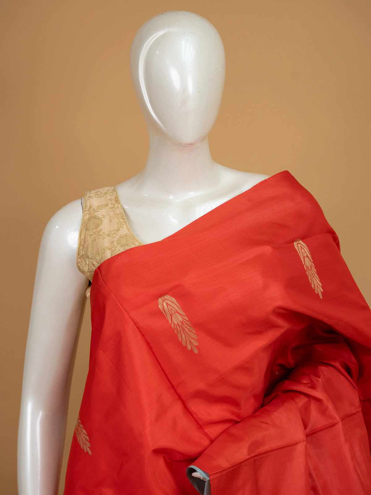 Red banana silk saree with gold butta and contrast light blue striped pallu