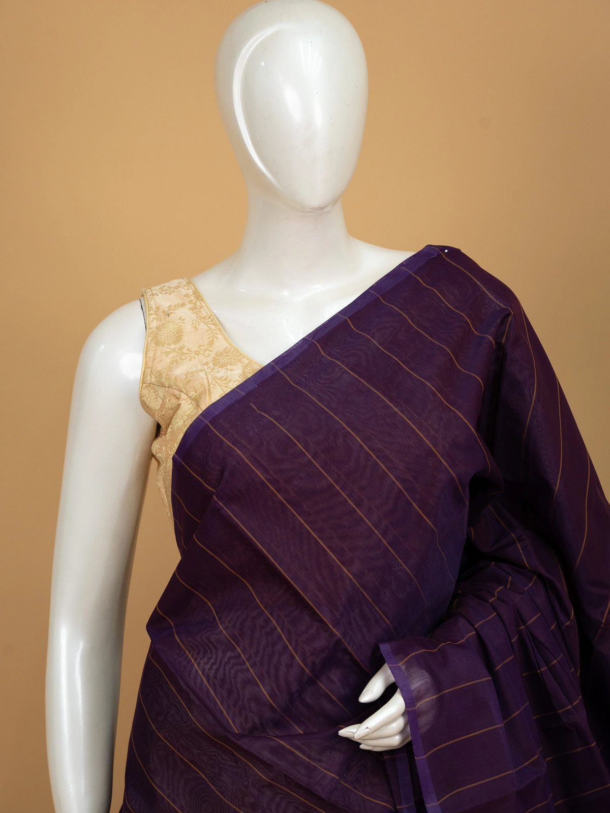 Purple silk cotton saree with gold stripes and mustard striped pallu
