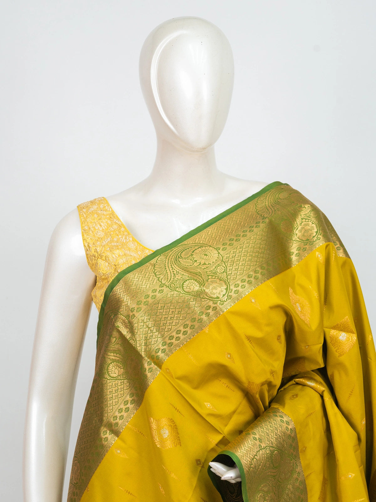 Yellow semi silk saree with contrast green and gold zari border and pallu