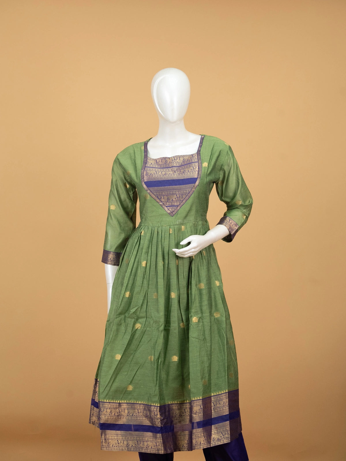 Green cotton silk Anarkali kurti set with navy zari woven yoke, elephant-motif border, and contrast navy dupatta