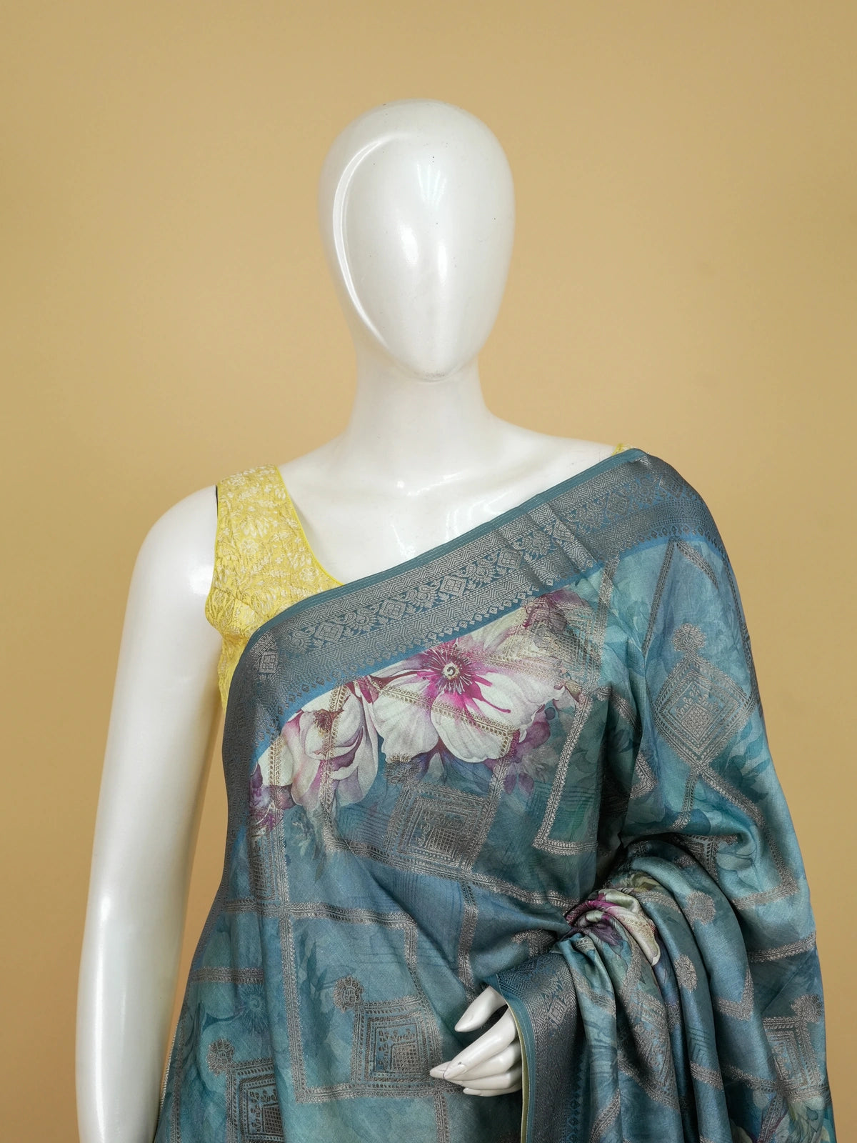Teal blue semi tussar saree with floral print, diamond zari grid and contrast geometric border