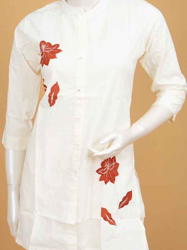 Off-white cotton co-ord set kurti with rust-red floral appliqué and straight pants