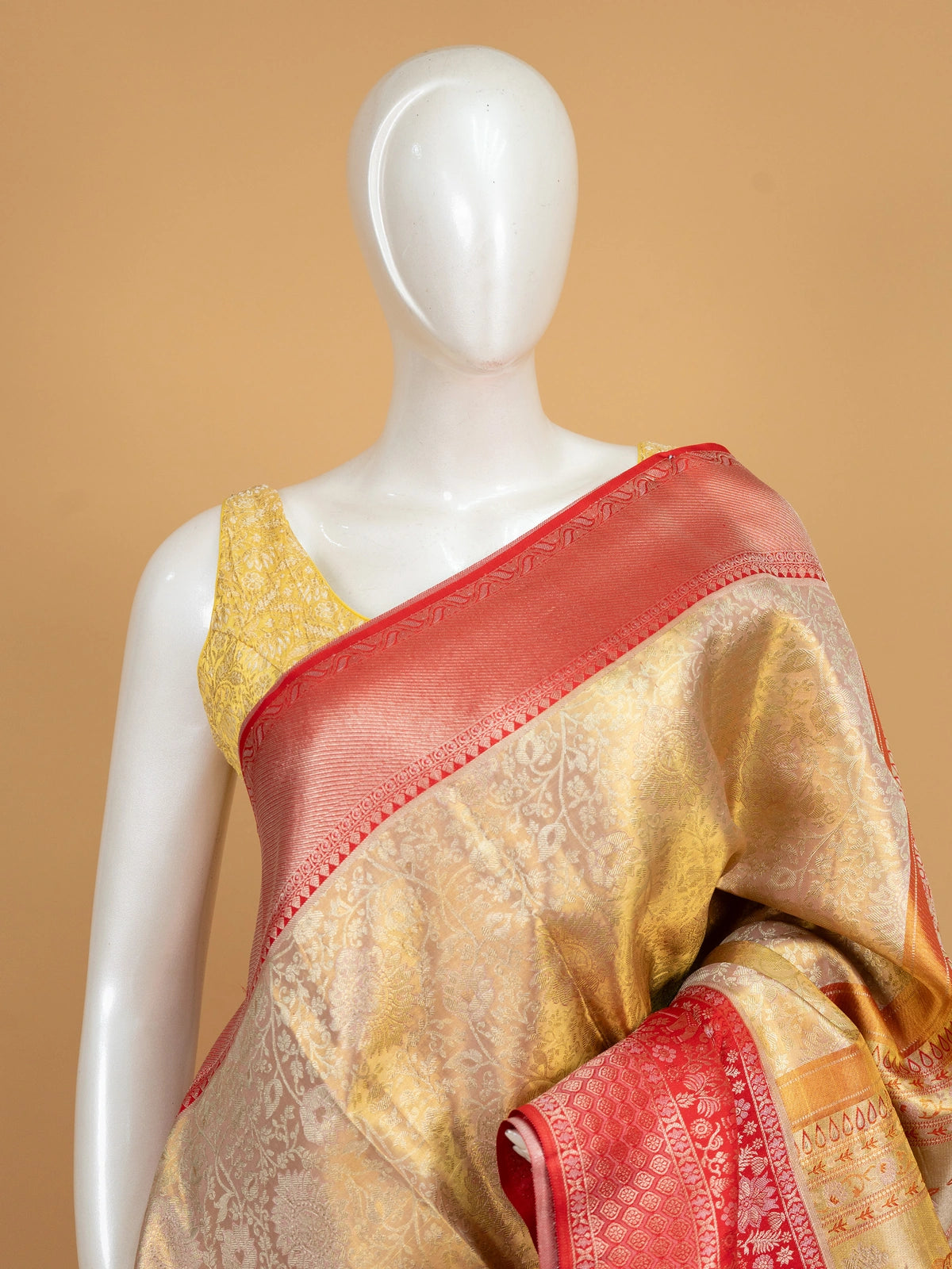 Cream-gold pure Kanchipuram silk saree with contrast red zari border and elephant motifs