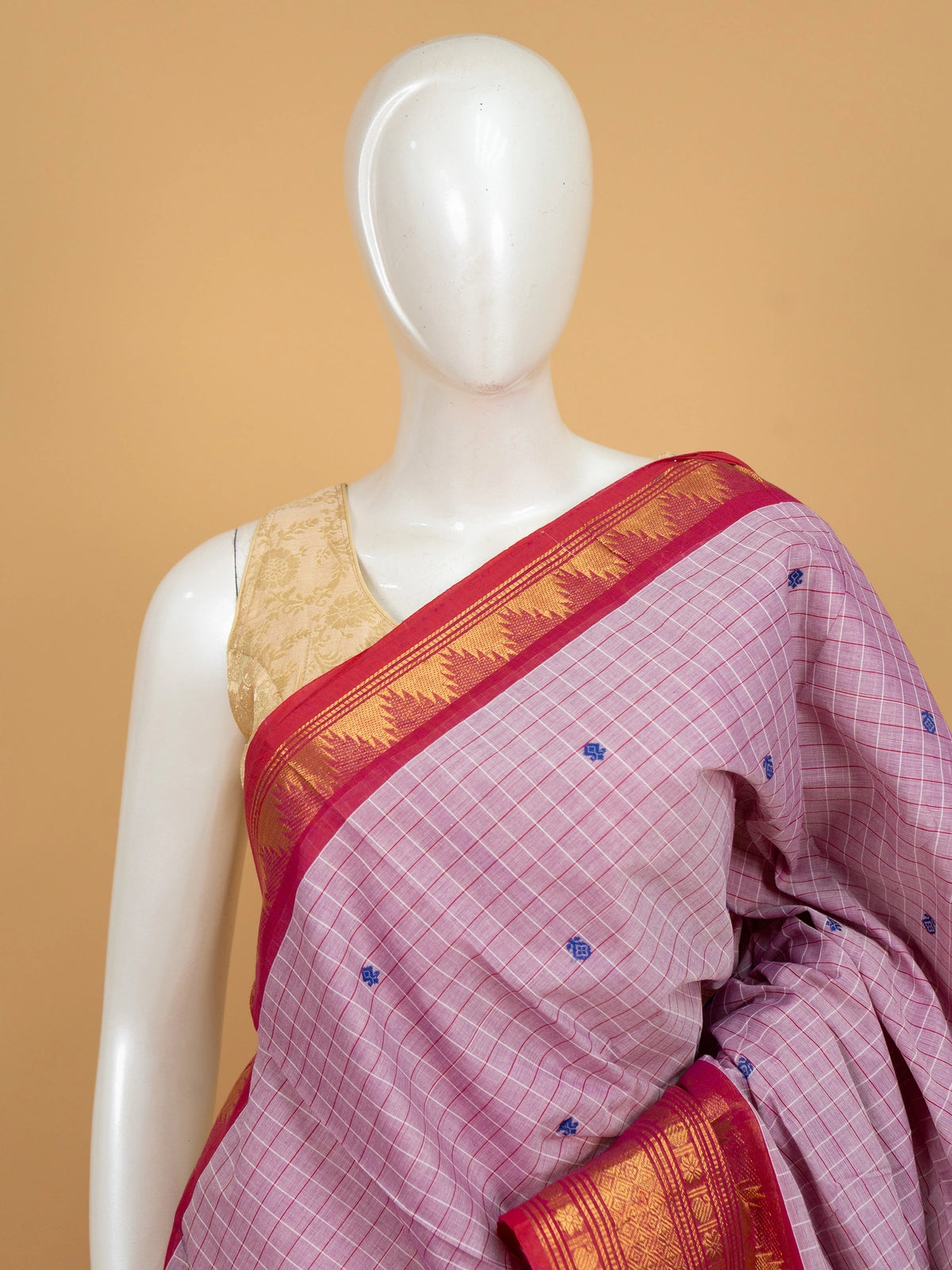 Lilac pink Chettinad cotton saree with red gold zari temple border and blue buttas