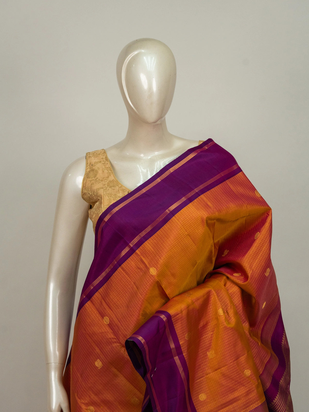 Orange and purple pure Kanchipuram silk saree with gold zari border and traditional motif pallu
