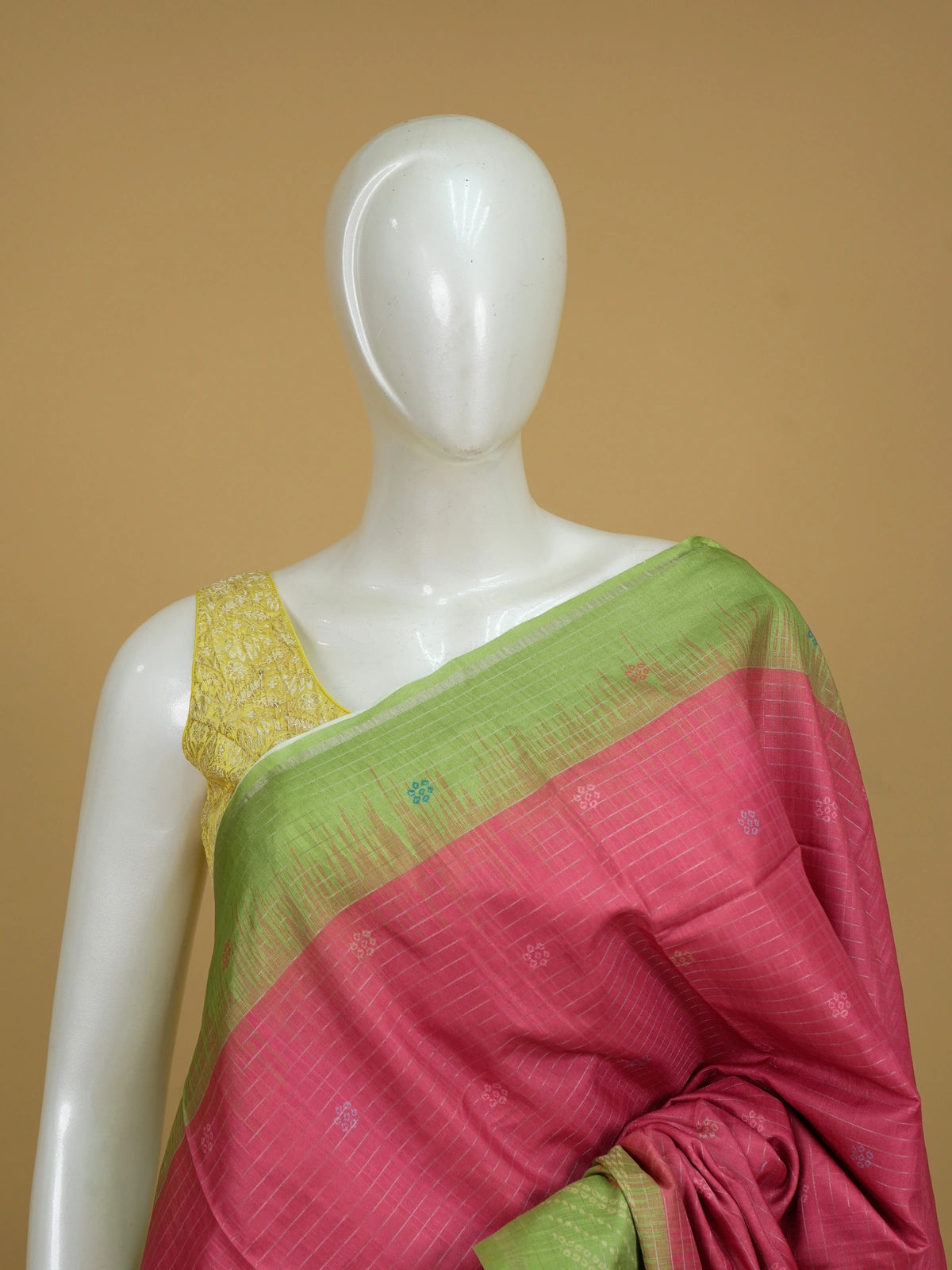 Pink Dola silk saree with contrast parrot-green border and bandhani paisley pallu