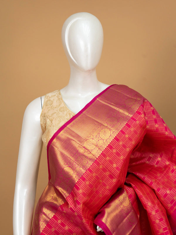 Pink and gold pure Kanchipuram silk saree with woven zari checks, floral border and ornate pallu