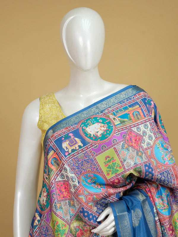 Multicolour Dola silk saree with Pichwai patchwork print and contrast blue zari border