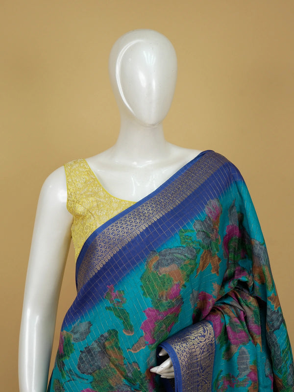 Teal Dola silk saree with multicolour floral print and contrast blue gold zari border