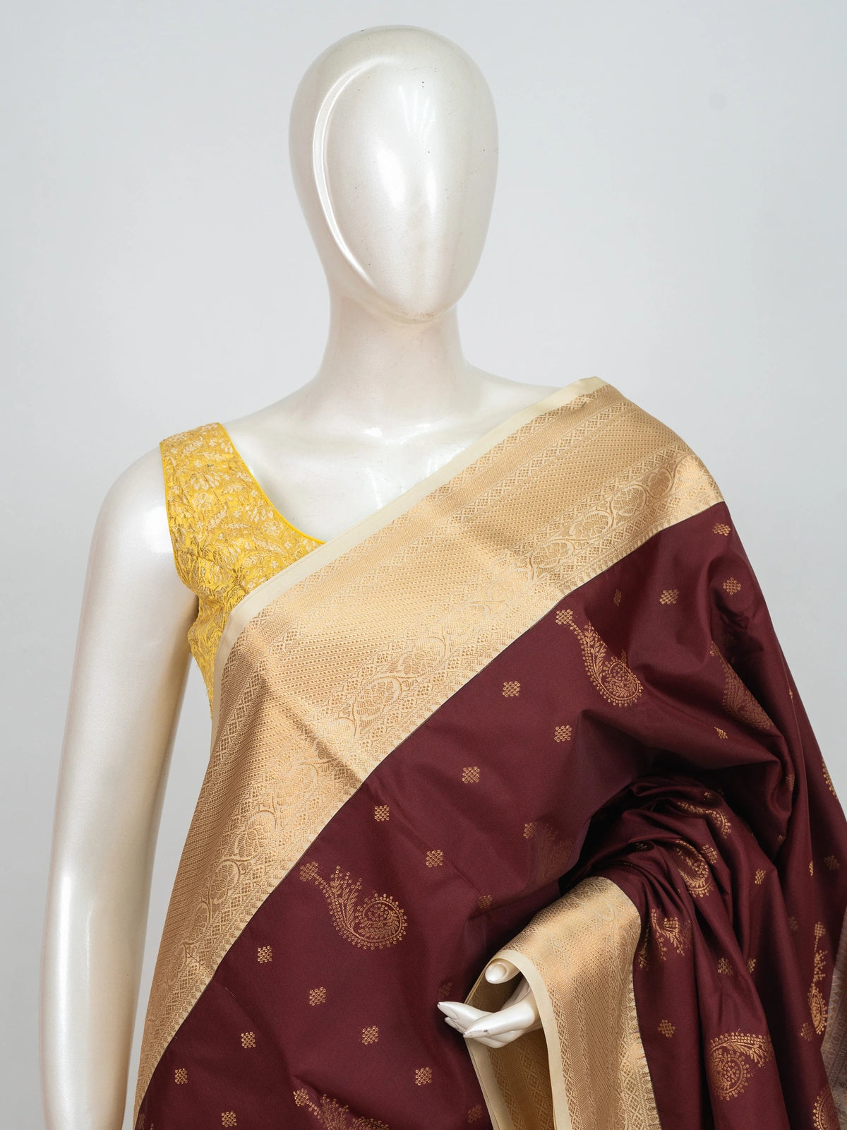 Maroon semi silk saree with gold zari paisley butis and contrast cream zari border