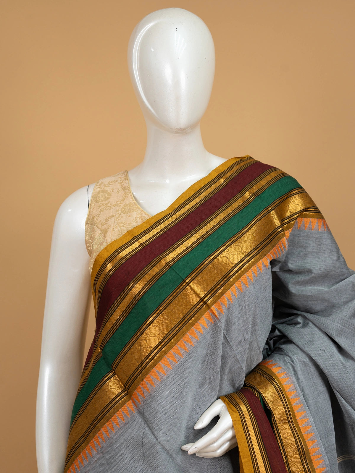 Grey Chettinad cotton saree with contrast mustard, maroon and green border and gold zari temple motifs