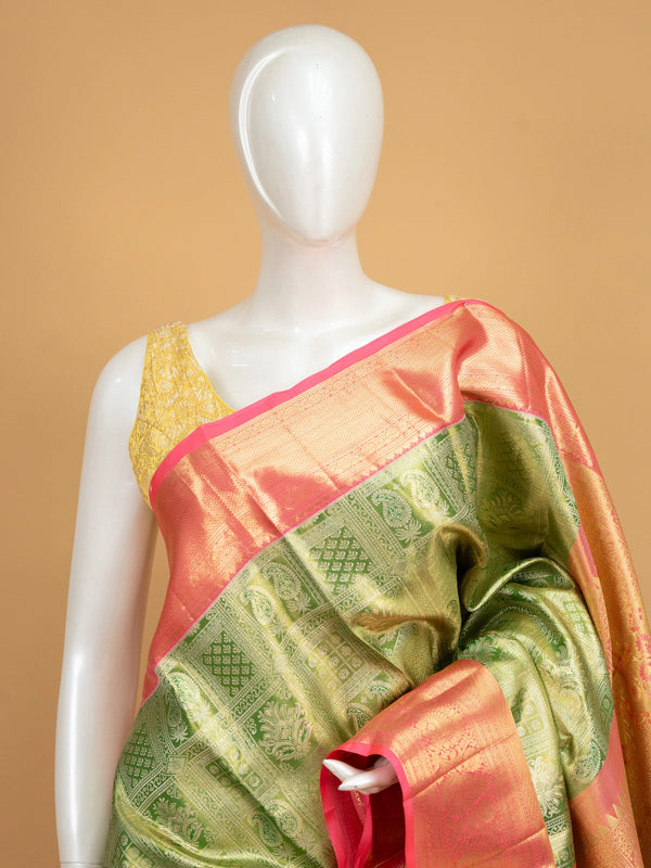 Green pure Kanchipuram silk saree with contrast pink border and gold zari brocade body and pallu