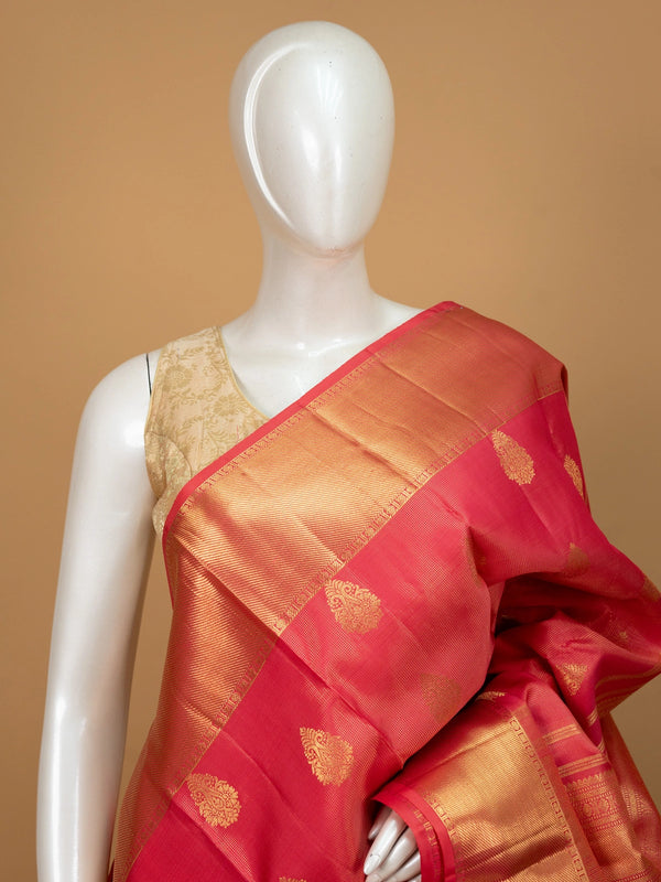 Pink and gold pure Kanchipuram silk saree with gold zari buttis, wide contrast border and woven zari pallu