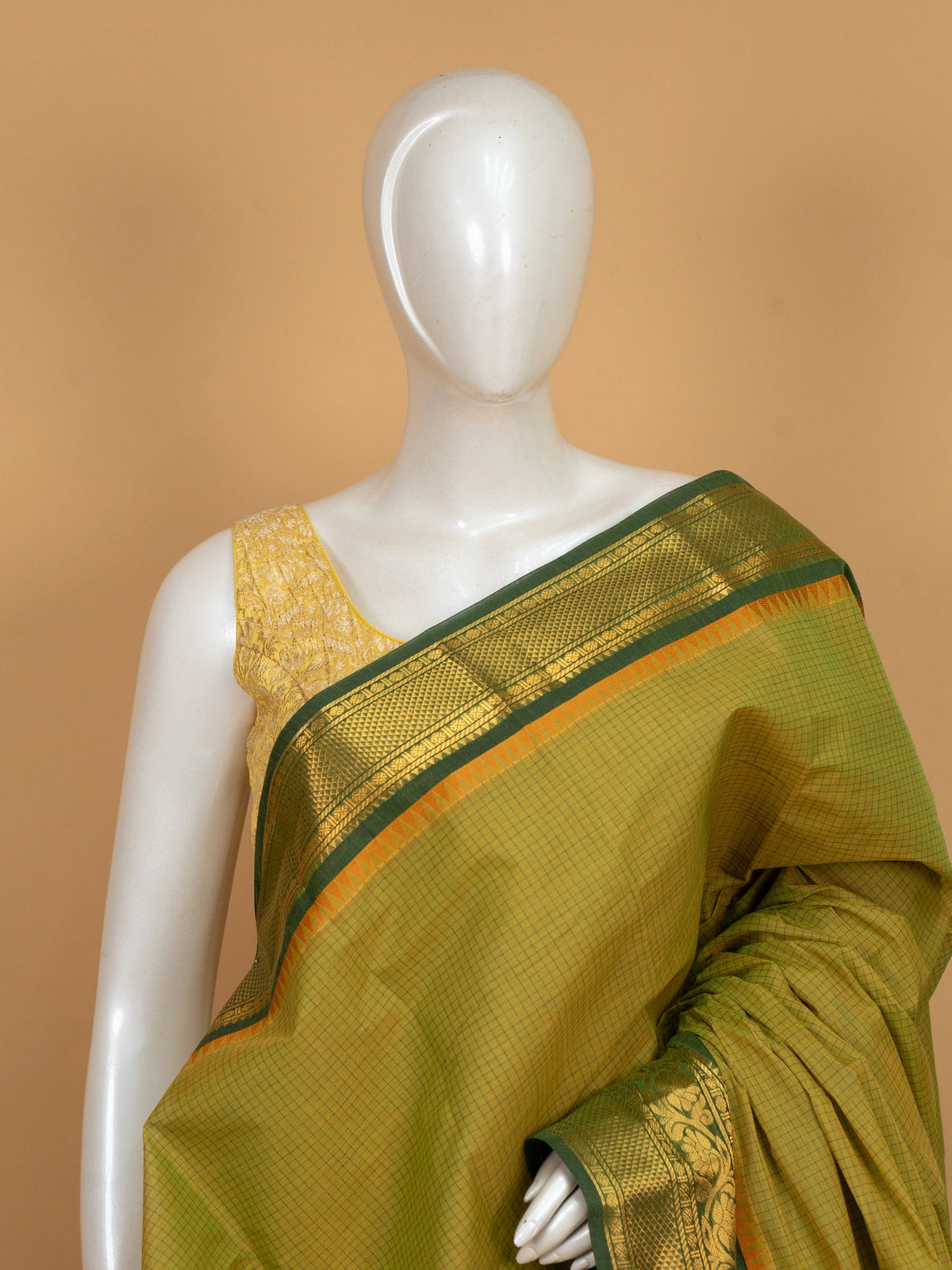 Mehendi green Chettinad cotton saree with checked body and gold zari floral border