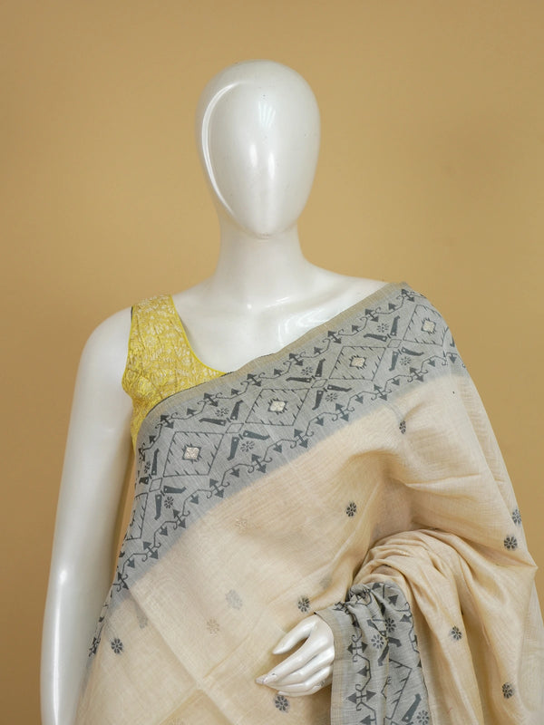 Cream and grey linen cotton saree with geometric grey pallu, border and silver zari floral buttas
