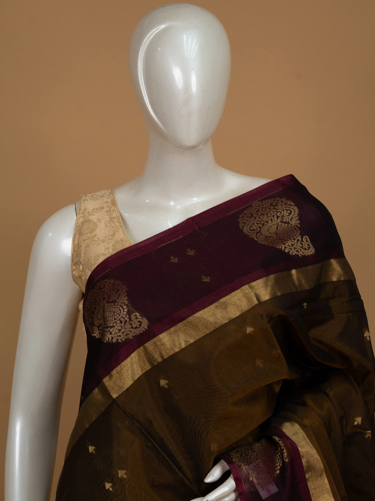 Mehendi-green silk cotton saree with maroon contrast border and gold zari peacock pallu