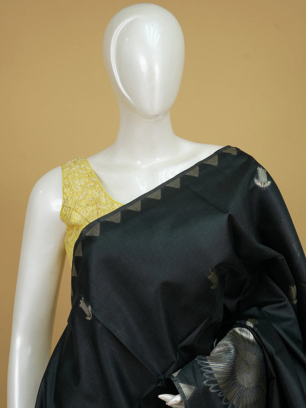 Black semi tussar saree with silver zari floral medallions and temple-design border