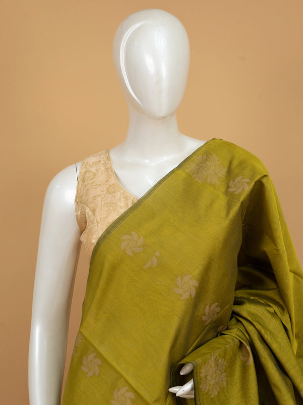 Olive green silk cotton saree with cream woven floral buttas and decorative border