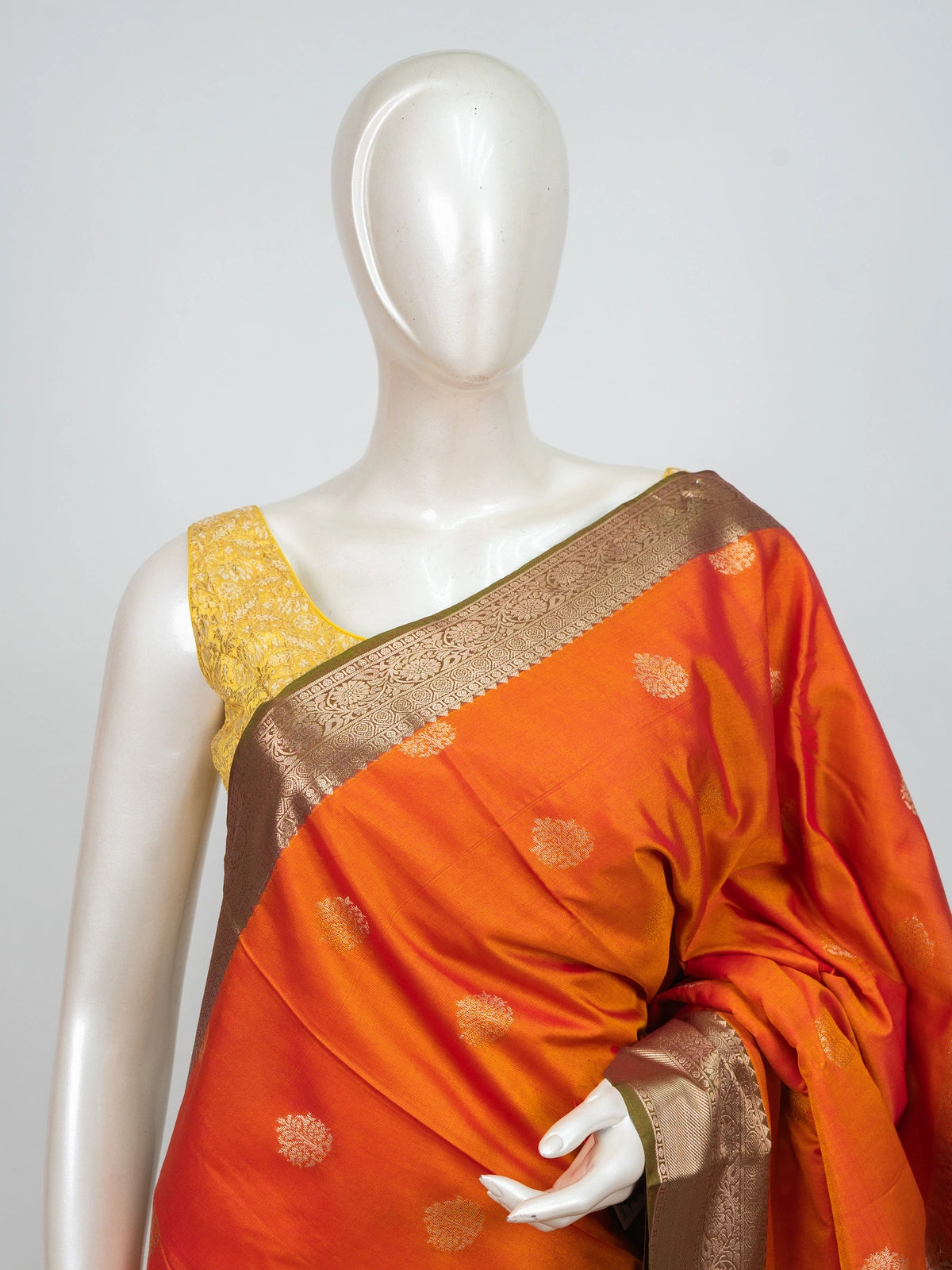 Orange semi silk saree with gold zari buta motifs and contrast copper-gold zari border and pallu