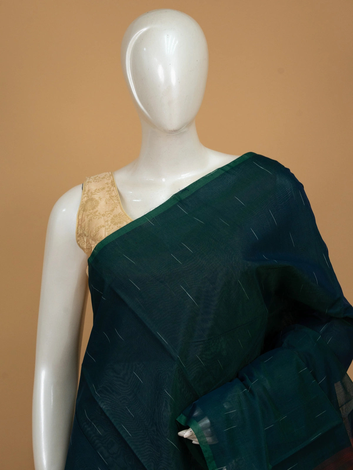 Teal green silk cotton saree with silver zari streaks and contrast maroon striped pallu