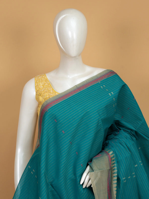Teal green linen cotton saree with gold zari stripes, pink buti motifs and contrast grey temple border
