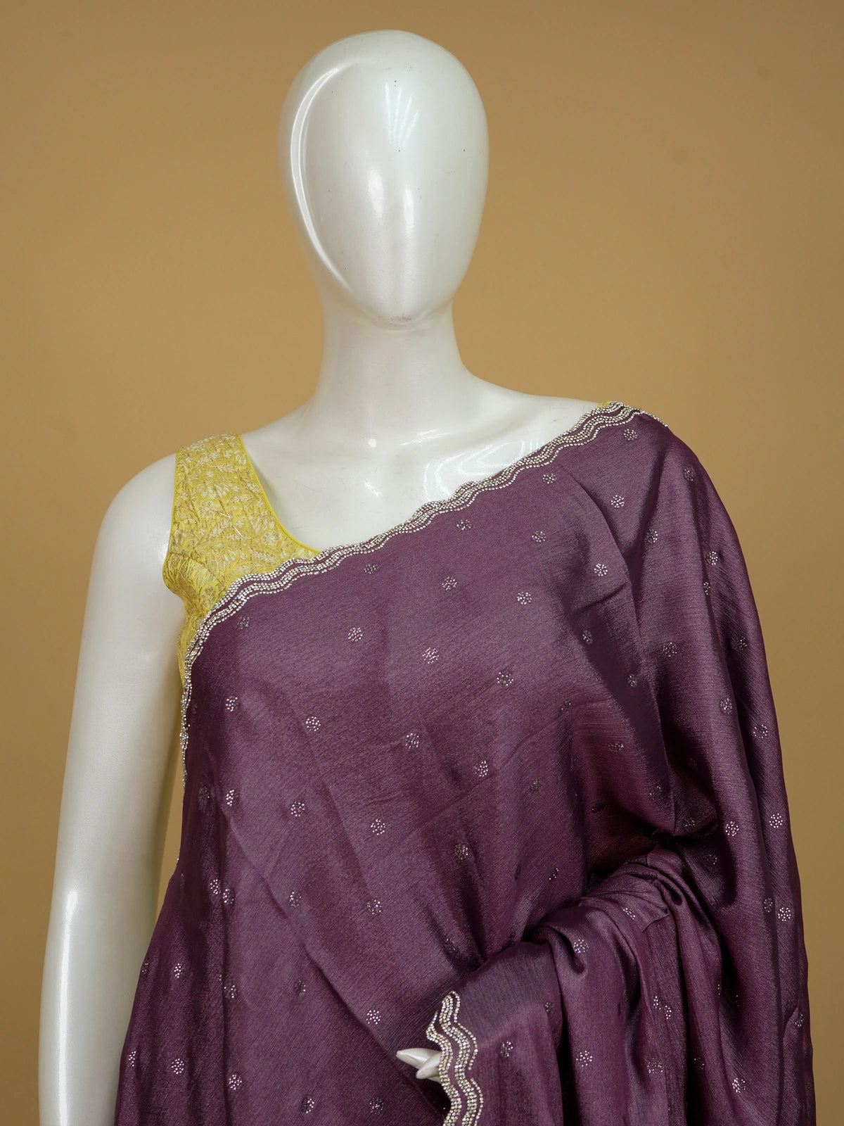 Wine purple designer saree with scattered stone buttas and scalloped silver stone border