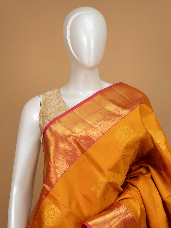 Mustard mustard pure Kanchipuram silk saree with contrast pink gold zari border and zari pallu