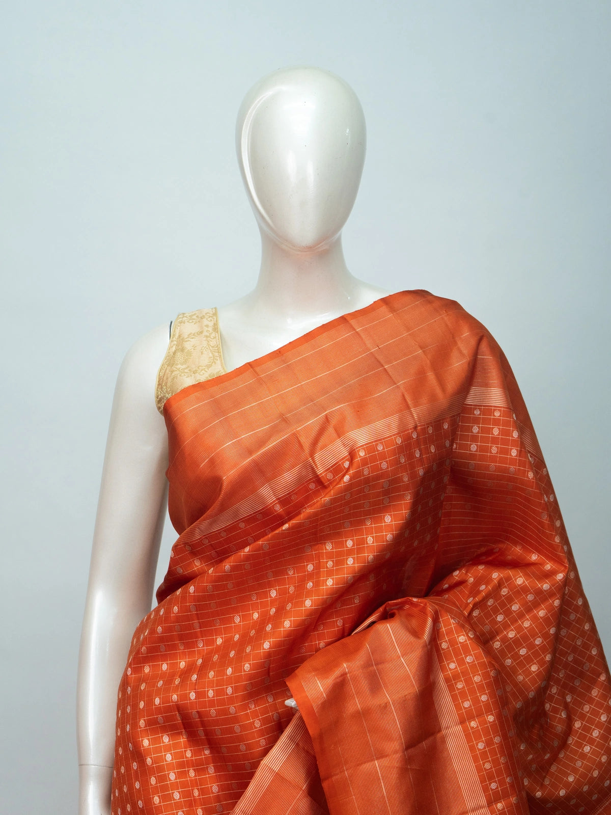 Orange pure Kanchipuram silk saree with self checks, butta motifs and copper-gold zari border