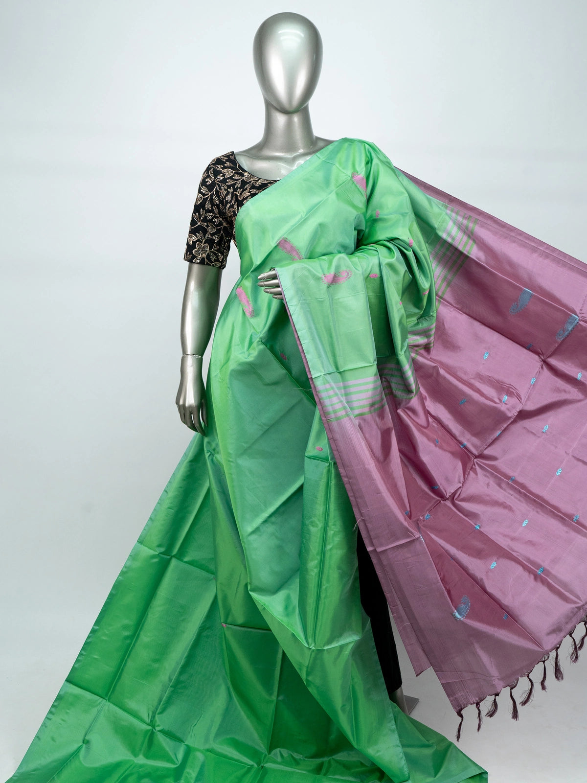 Green banana silk saree with mauve pink contrast pallu, paisley buttas and striped border