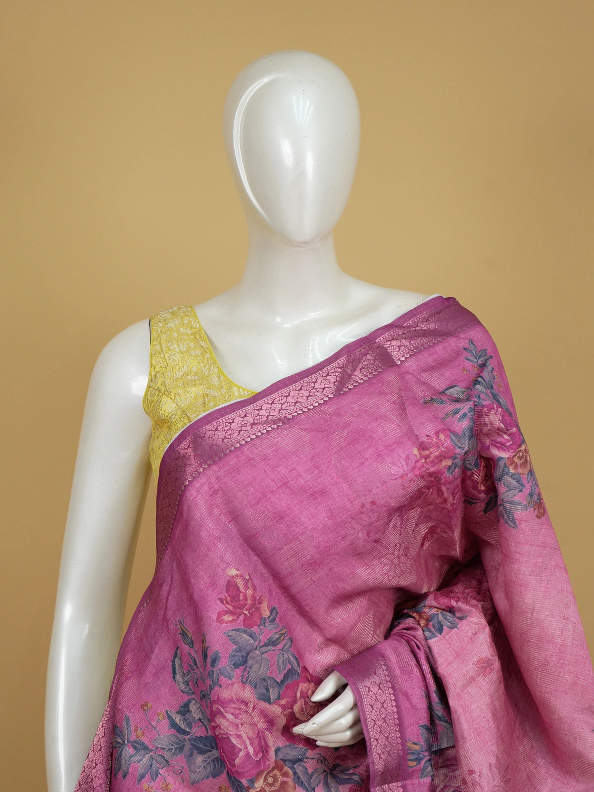 Pink semi tussar saree with floral print body and magenta zari border