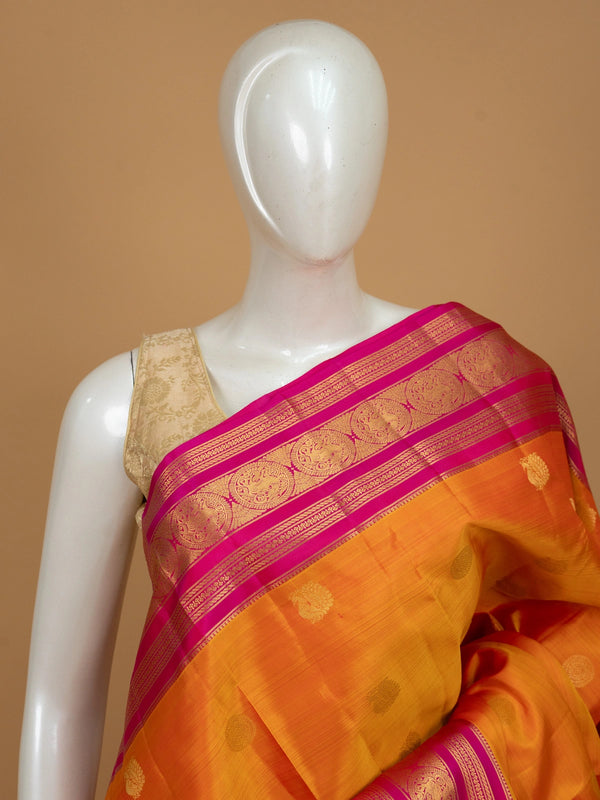Orange and pink pure Kanchipuram silk saree with contrast gold zari border and buttas