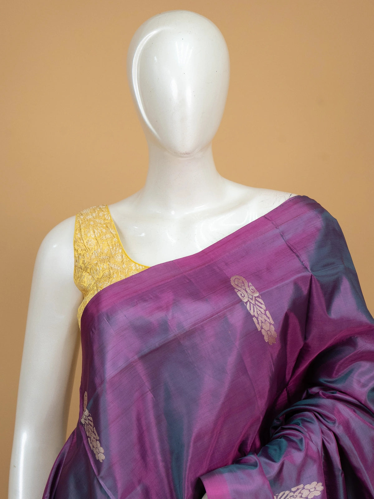 Purple and teal dual-tone banana silk saree with gold zari buttas and striped border