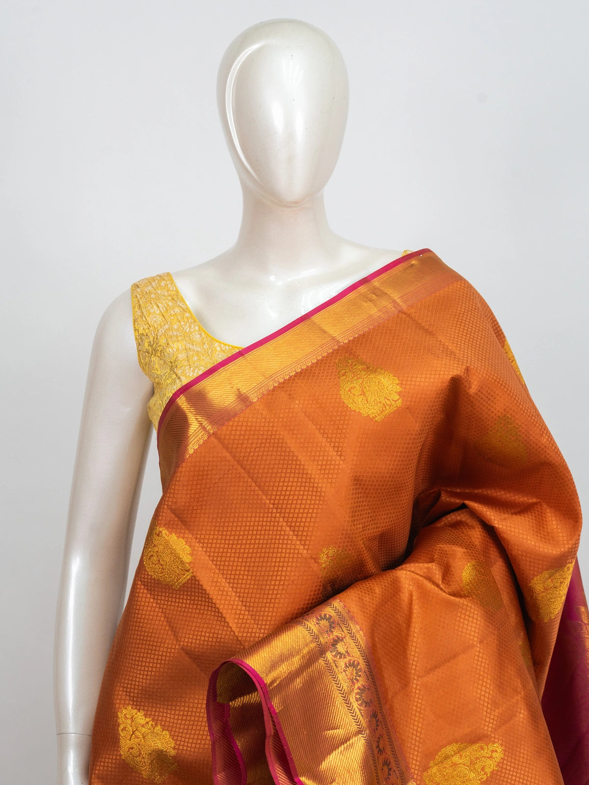 Rust orange pure Kanchipuram silk saree with pink and gold zari contrast border and woven pallu
