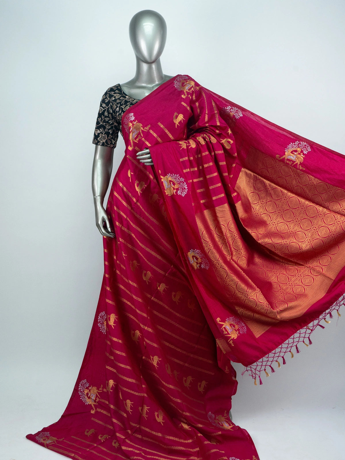 Rani pink semi raw silk saree with gold zari folk motifs, brocade pallu and contrast black blouse