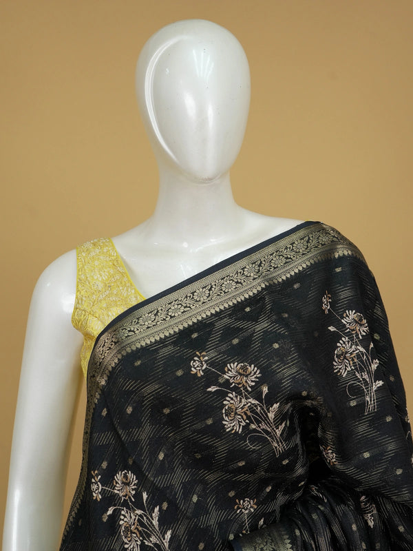 Black designer georgette saree with gold zari border and floral printed body