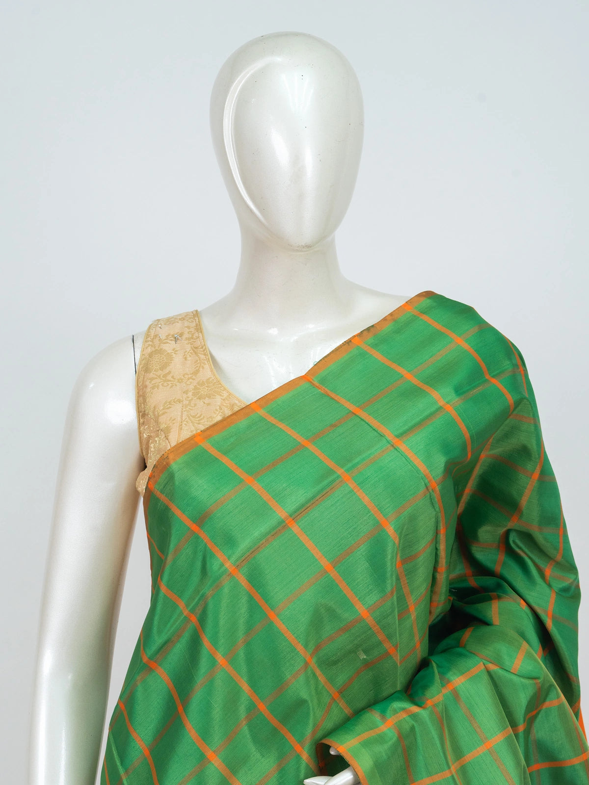 Green and orange checked banana silk saree with contrast orange pallu and blouse