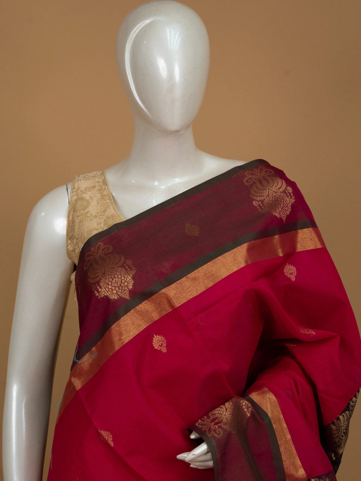 Rani pink silk cotton saree with contrast green and gold zari border and pallu