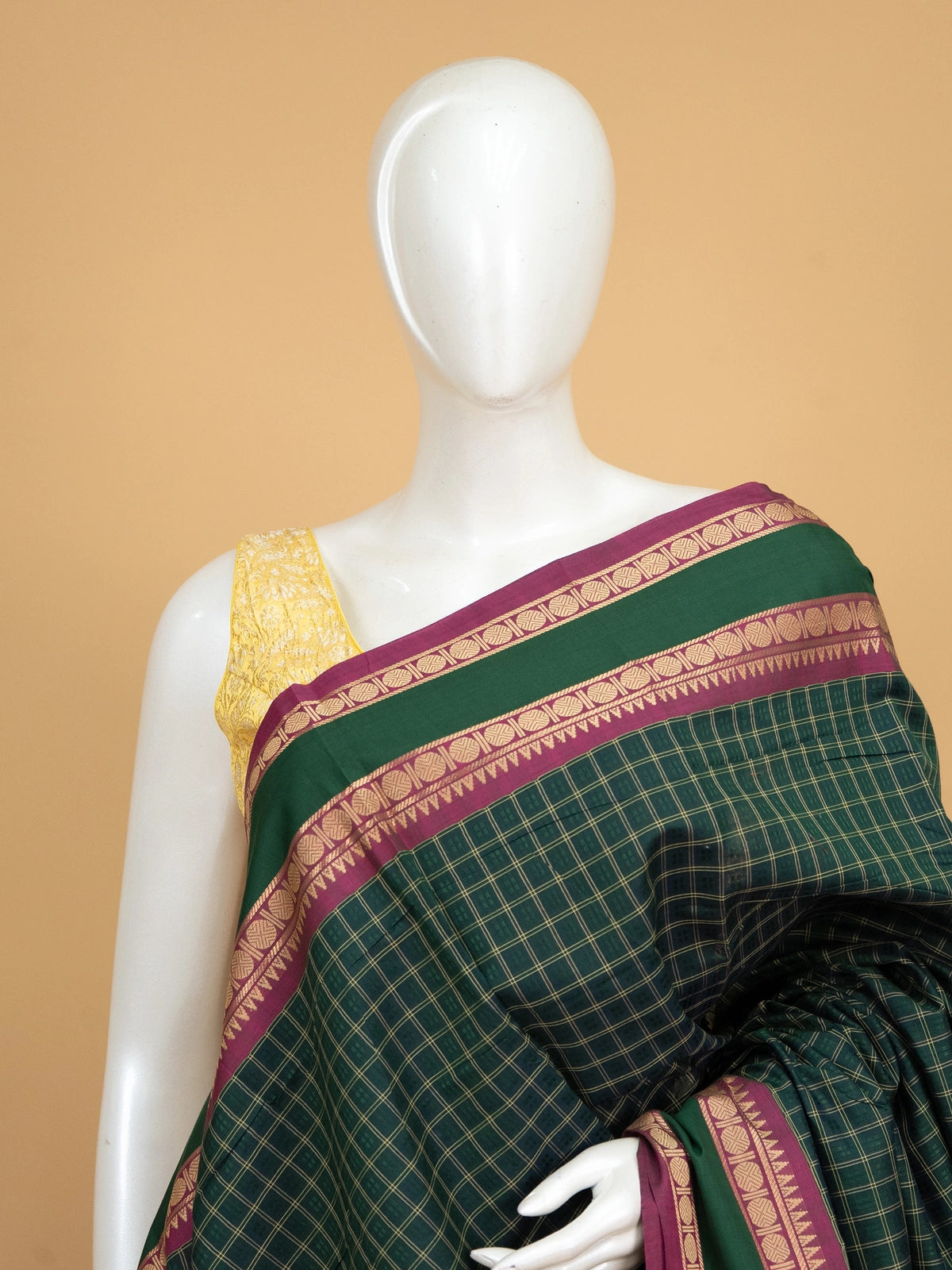 Dark green Chettinad cotton saree with gold checks and contrast magenta zari border
