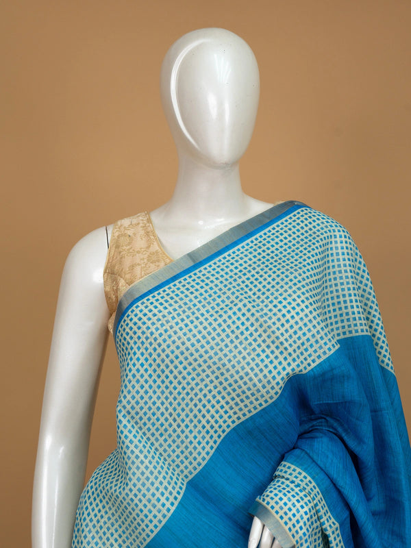 Peacock blue linen cotton saree with cream checked body, silver zari border and printed pallu
