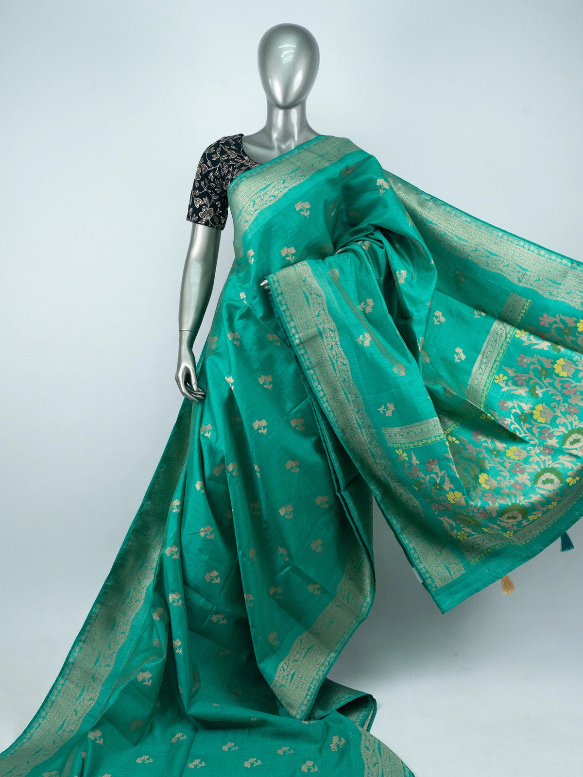 Sea green semi raw silk saree with gold zari floral buttas, contrast zari border and multicolour floral pallu