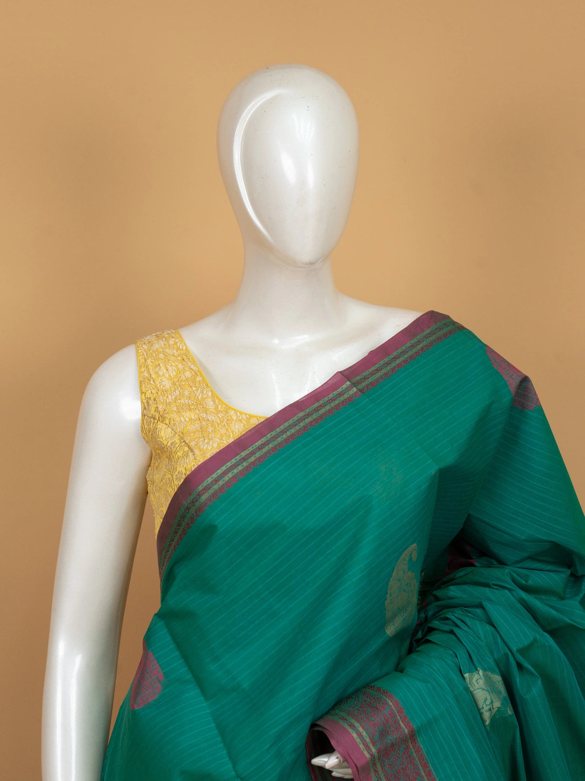 Teal green semi raw silk saree with magenta gold zari paisley border and buttas