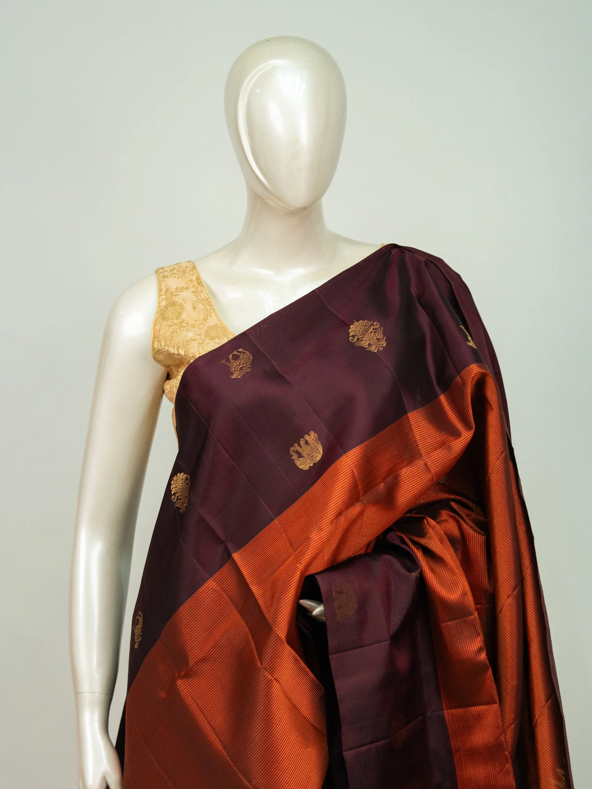 Wine purple pure soft silk saree with rust orange contrast border and gold zari butta motifs