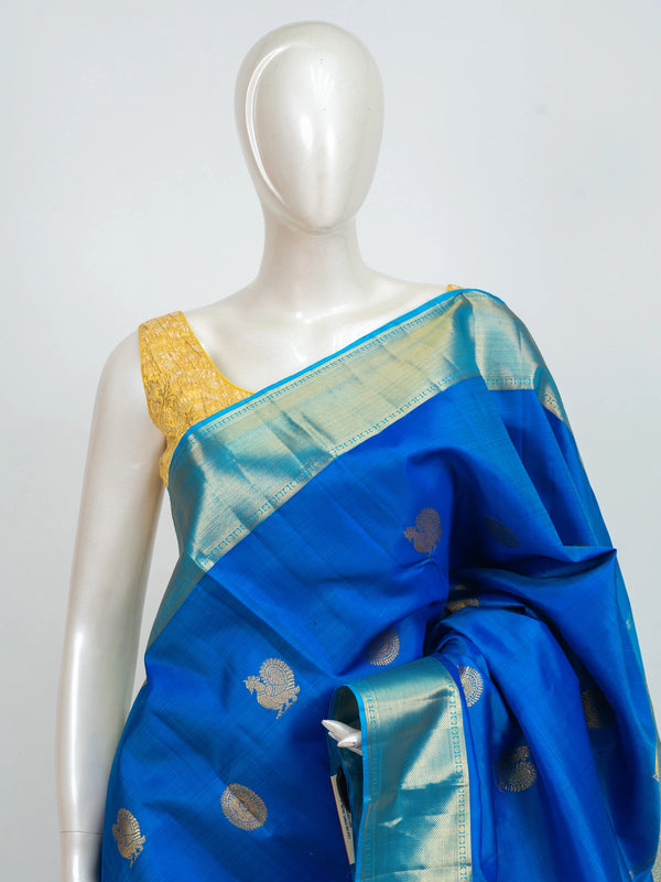 Royal blue pure Kanchipuram silk saree with turquoise and gold zari border and woven peacock motifs