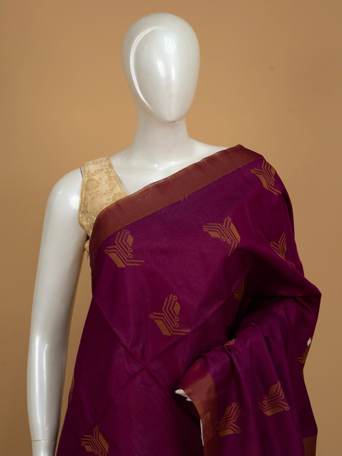 Magenta purple pure silk cotton saree with contrast mustard border, geometric gold buttas and tasselled pallu