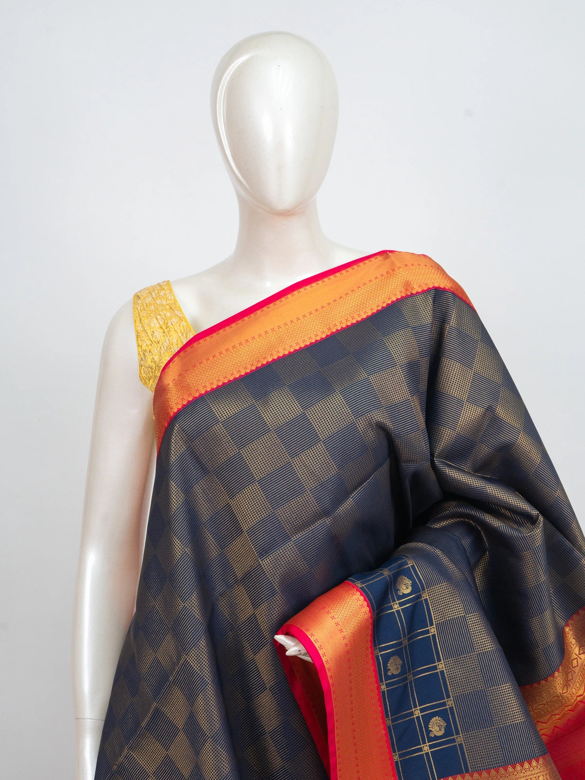 Navy blue Kanchipuram fancy silk saree with gold zari checks and contrast orange-red zari border and pallu