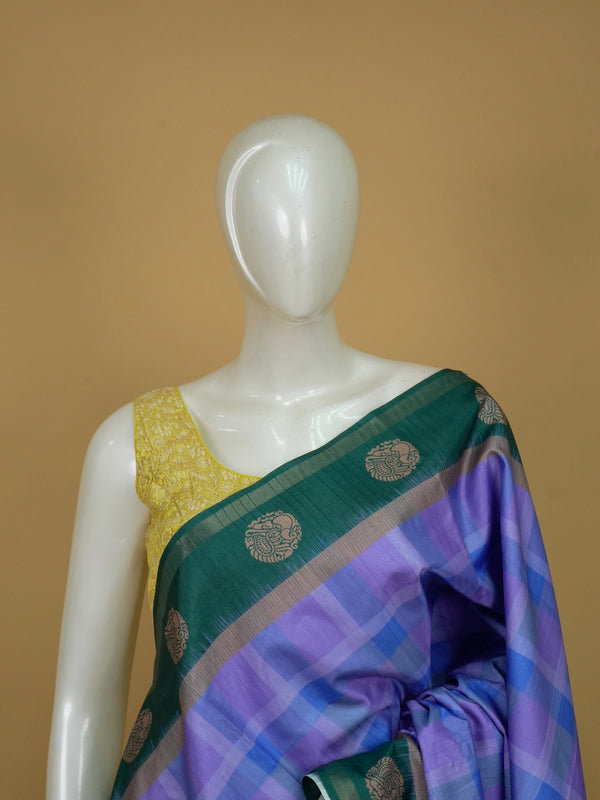 Lavender and blue checked Dola silk saree with green contrast border and copper motifs