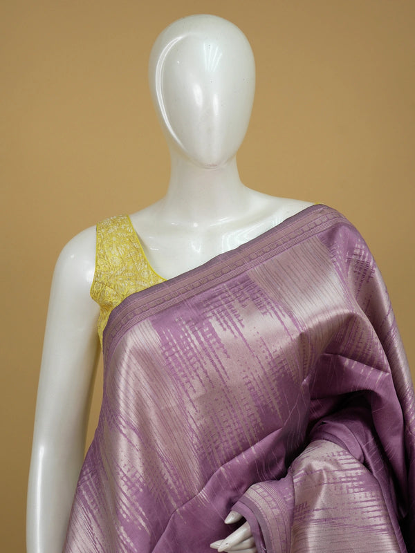Mauve semi tussar saree with silver zari streaks and temple motif border