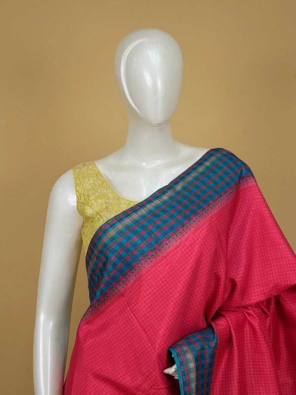 Magenta pink Dola silk saree with yellow checks, teal blue contrast checked border and paisley pallu